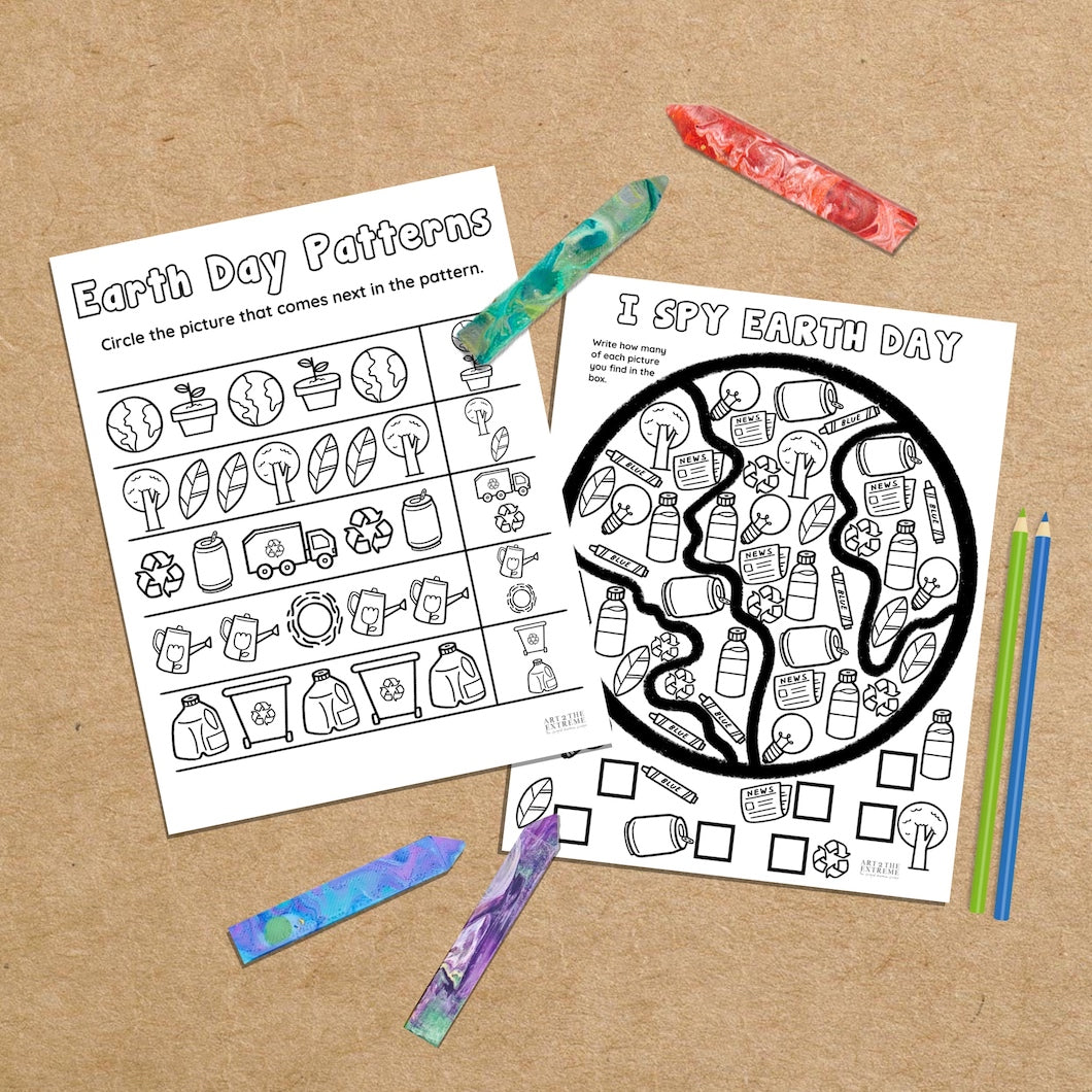 Two black and white printable Earth Day puzzles for kids. One is an Earth Day Patterns page and the other is an I Spy Earth Day worksheet. Coloring sheets are on a brown background with 4 Crayon Stix and two colored pencils next to them as photo props. 