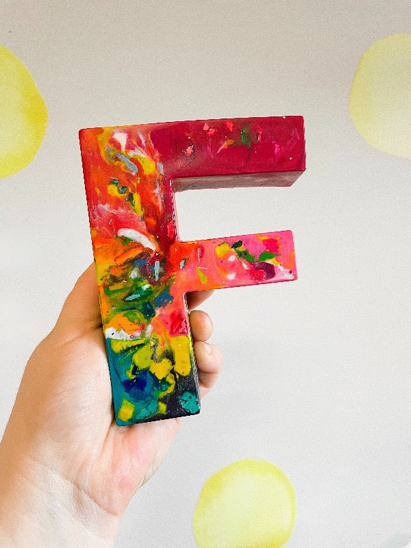This large letter F rainbow crayon is larger than an adult hand  and makes a great back to school gift or stocking stuffer gift idea for kids. Created by crayon shop, Art 2 the Extreme, who specializes in custom crayon design, you can choose your rainbow colors, making this a perfect party favor for kid.  