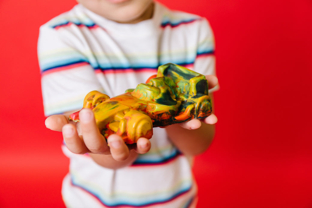 Race car color ideas, Rainbow crayon in the shape of an IndyCar, IndyCar gift idea. This rainbow crayon is shaped like a race car and colors in multiple rainbow colors. Created by crayon shop, Art 2 the Extreme and a perfect addition to race car coloring pages as a gift idea.